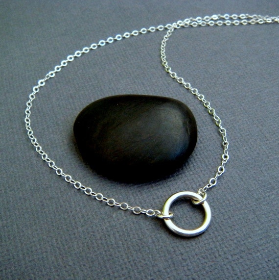 silver circle necklace. small sterling ring. simple geometric.