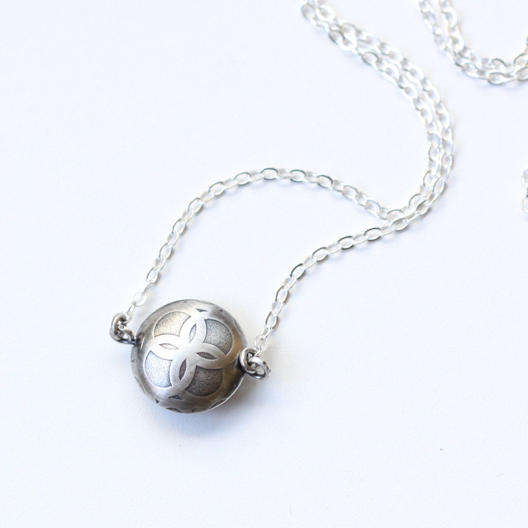 Dainty sterling silver necklace of a solitary bead artisan