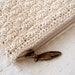Cream crocheted pouch with organic cotton lining