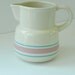 Vintage McCoy Stonecraft Pottery Pitcher. Pastel Pink and Blue Stripes on Ivory.