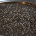 10 grams of 6/0 sized Frosted Gold Lined Black Diamond TOHO seed beads (TH104)