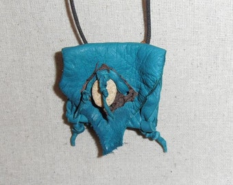 Pond- This Wisdom Pouch is made out of Turquoise colored Deerskin leather and features a piece of Brown Fish Hide leather and a Beach Stone