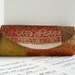 Patchwork brocade clutch bag in autumn harvest colors.
