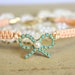 Friendship bracelet peach braided with real Turquoise swarovski rhinestones .