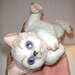 Adorable vintage cat on back figurine....wonderful blue eyes..1983 Enesco kitten