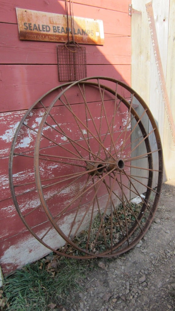 Items similar to 2 Huge Antique Old Fashioned Farm Wheels Large Old