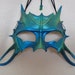 Blue-green leather mask, water dragon youngling, or catlike aquatic being...
