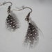 Small Spotted Feather Earrings with a Clear Bead