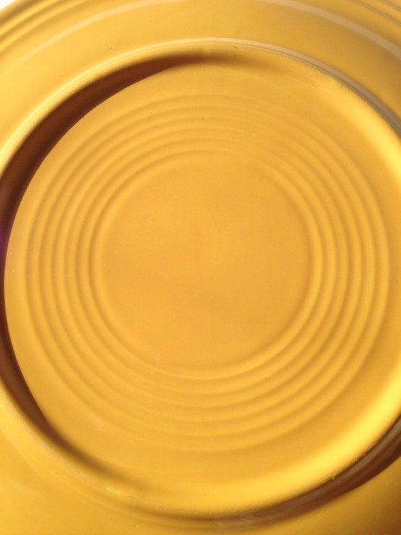 Original unmarked fiestaware dinner plate in yellow