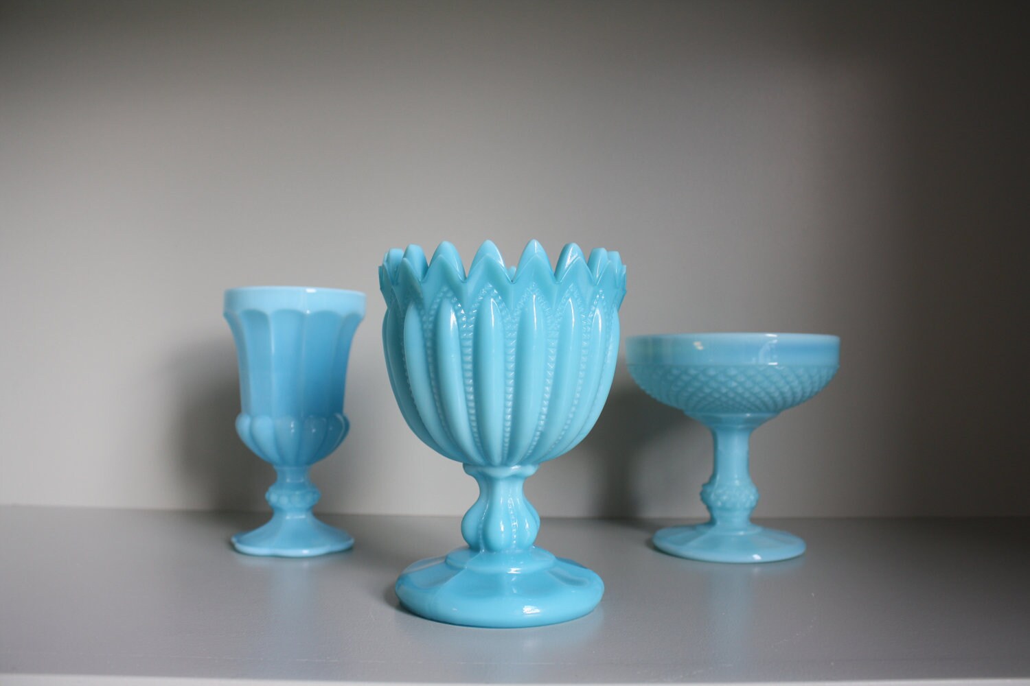 Collection of 3 blue milk glass vases