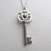 Antiqued silver skeleton key necklace on delicate silver chain