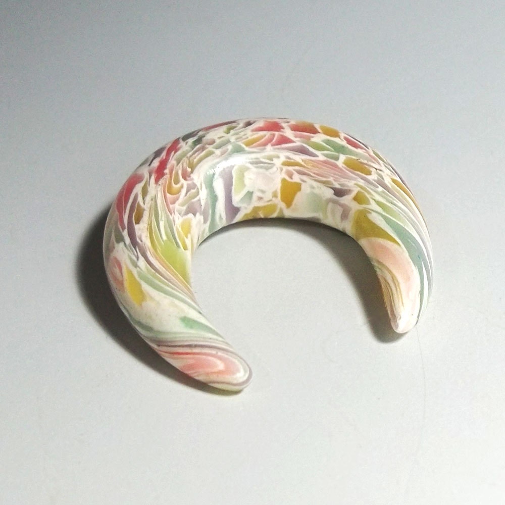 Gauges 00 g polymer clay plugs for srtretched ears. Stained