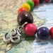 Om Infinity Mala Bracelet in Magnasite Gemstones with Silver Charm