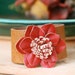 Amber. burnt red, floral,brown leather cuff. Tiedupmemories