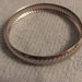 Silvertone bangle bracelet with a ridged design