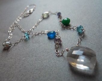 Leaf cut rock crystal quartz, emerald and apatite necklace, On a clear ...