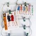 vintage 5-tier metal skirt hanger with 10 green clips - photo memory holder - 1960s