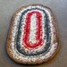 Brown, Gray, Red and White Oval Plarn Rug