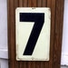 Vintage Embossed Tin Gas Station Sign Lucky Number Seven 7