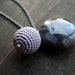 Crochet and a gemstone combination in grey and lila