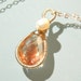 Gorgeous AAA Oregon Sunstone and freshwater pearl wire wrapped and coiled sterling silver pendant necklace