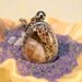 Natural moss and citrine miniature terrarium window locket necklace. Semiprecious stone. Medium length ball chain.