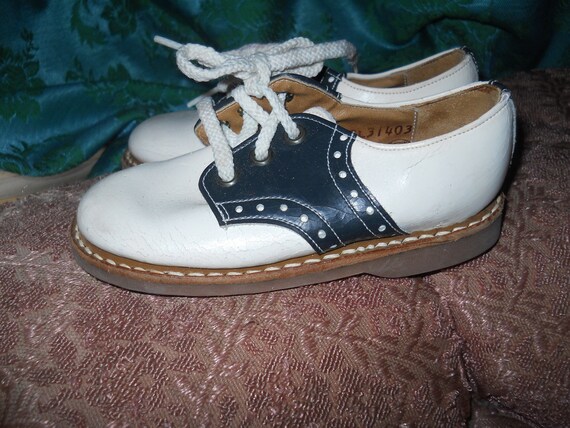 Items similar to vintage rare CHILDS BUSTER BROWN saddle