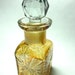 Vintage Golden Cased Crystal Perfume or Oil Bottle with Faceted Ground Glass Stopper