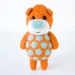 Vibrant orange bear with sky blue polka dots