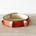 Tangerine Leather Bracelet with Rose gold Skull Studs