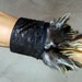 Leather and feather cuff bracer with python