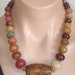 RESERVED: ASHIRA Carved Jade Feature Gemstone, Brass and Colored Graduated Jade