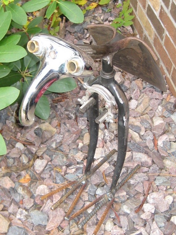 Items similar to recycled, metal yard art, found object, on Etsy