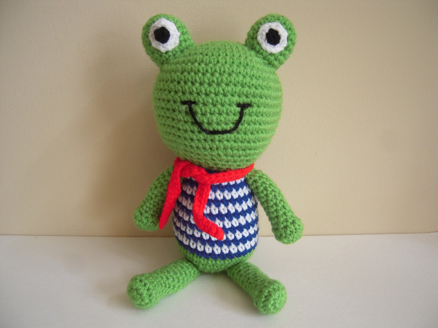 Crocheted Stuffed Amigurumi Frog With Striped Shirt and Scarf