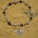Egyptian Isis bracelet in amethyst and bronze.