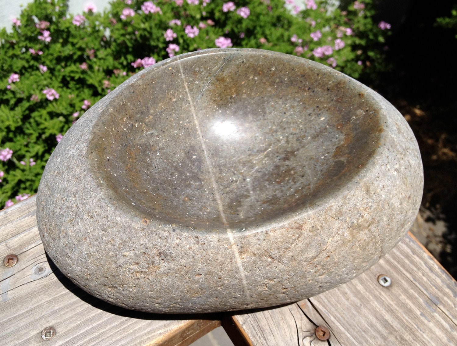 Hand carved river cobble stone bowl by Visualscapes on Etsy
