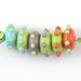 Handmade Lampwork Glass Bead set. Donuts with raised dots.