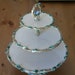 Vintage three tiered ceramic serving dish with blue bird, raspberries, vines