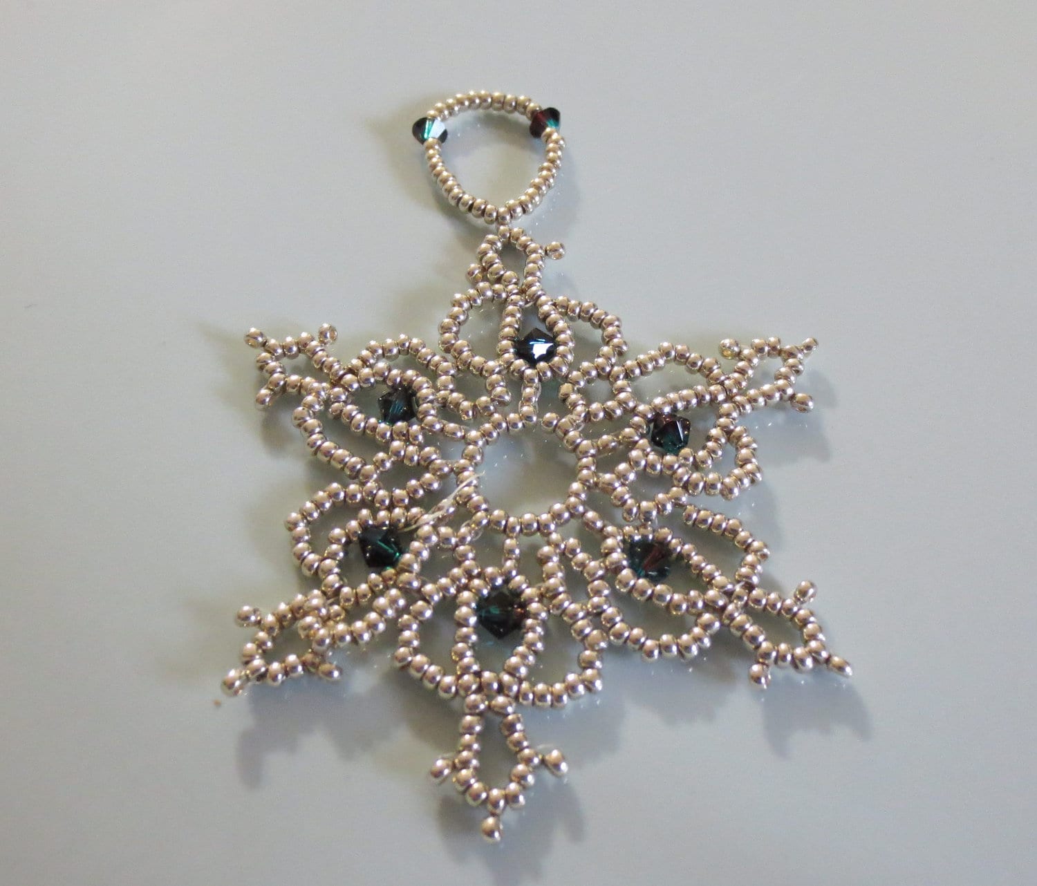 Bead and crystal snowflake / wreath ornament.