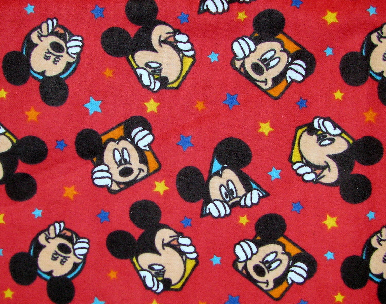 Mickey Mouse flannel fabric Out To Play Star Toss red YARD