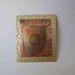 Copper brooch made from copper and brass sheet metal that was heat treated.
