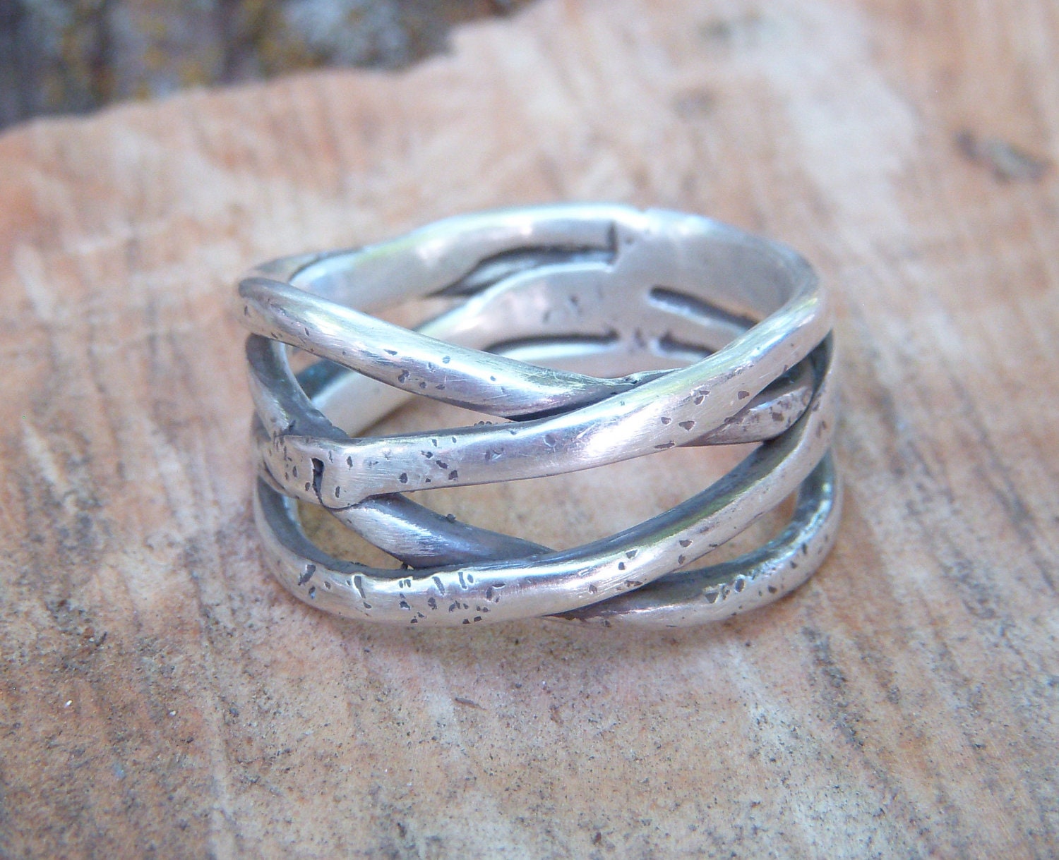 Silver lost wax cast one of a kind ring with a braided and