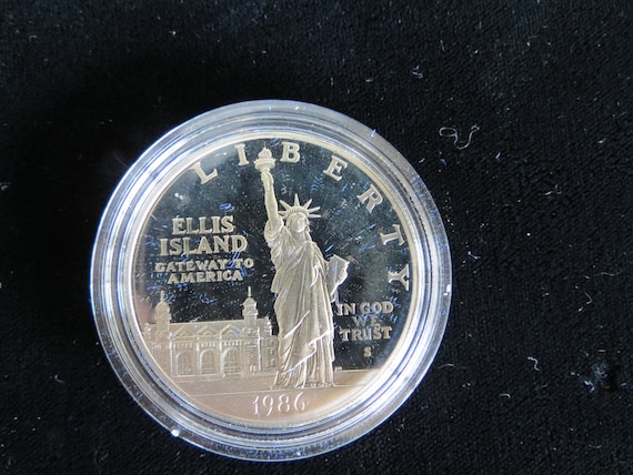 value of a 1986 proof ellis island liberty coins silver dollar