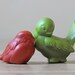 orange and lime green ceramic bird figures