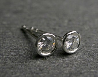 Bezel set round brilliant cut Moissanite and sterling silver stud earrings 4mm .50 carat tw