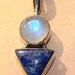 Elder Female Courtwind Angel Connected to a Rainbow Moonstone and Lapis Lazuli Pendant Activated 9 Times