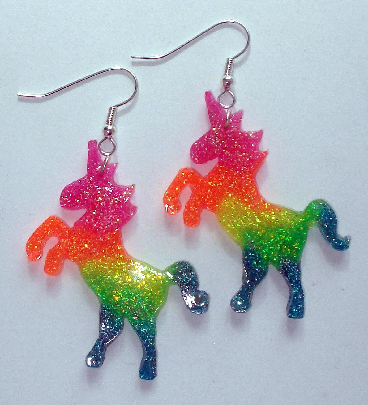 UV glow neon rainbow glitter unicorn earrings by ToxicGlamour