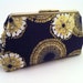 navy blue and gold clutch