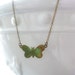 Small butterfly necklace in a brass verdigris patina - minimalist style in aqua green hues on simple delicate bronze chain