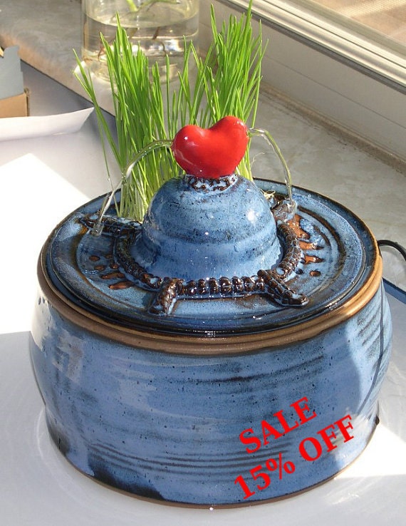 Handmade ceramic cat drinking fountain with buildin cat grass